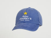 Blue cap with 'Mellow Johnny's Bike Shop' logo on a light gray background