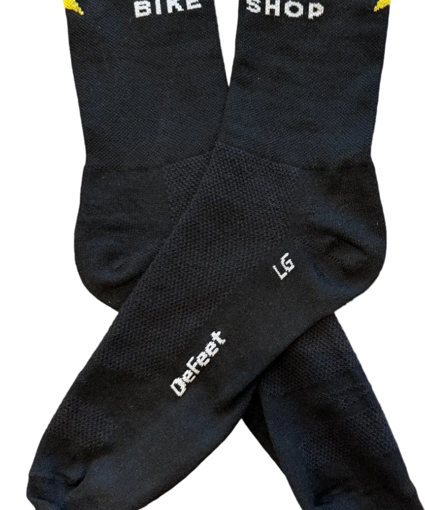 Black socks with branding on a wooden surface