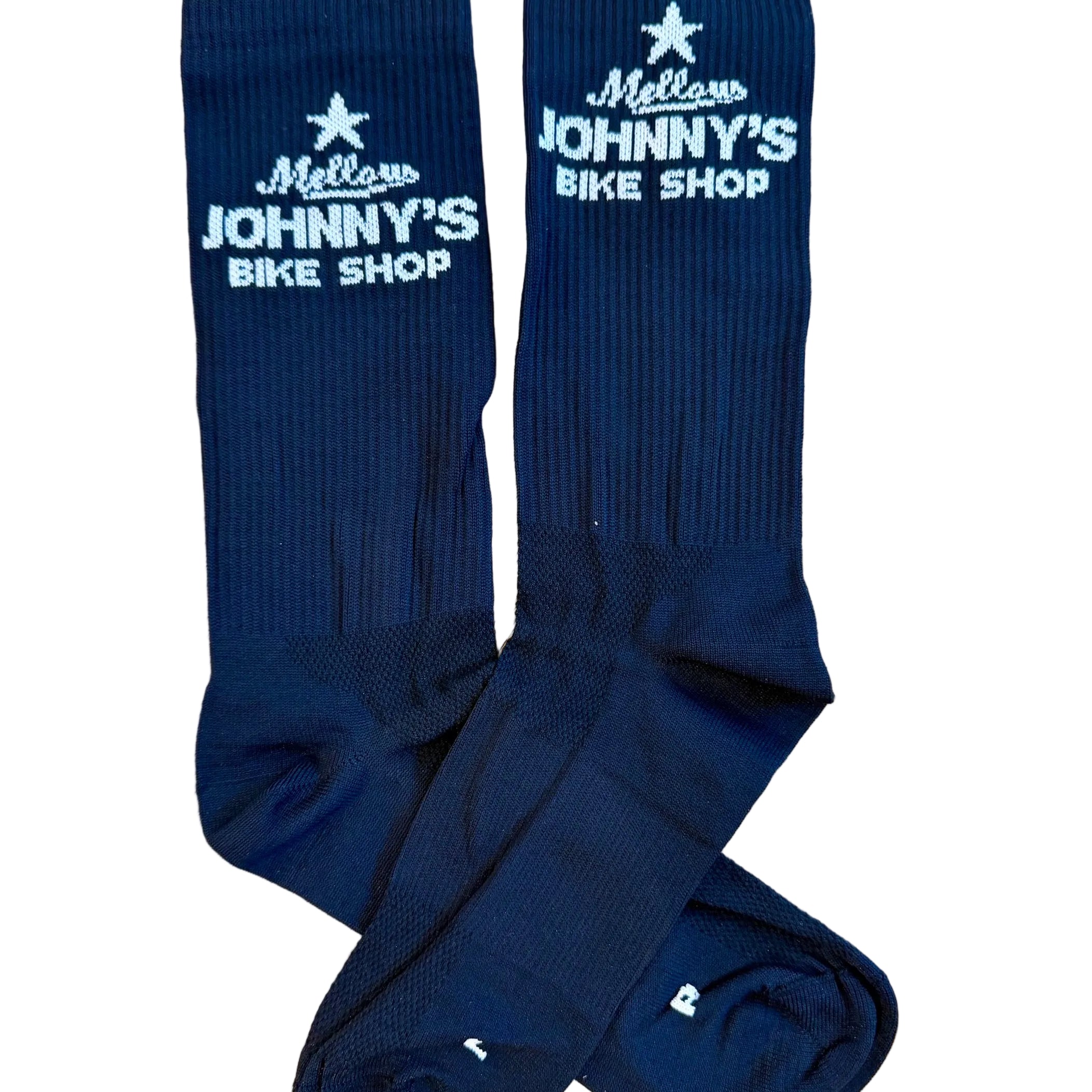 A pair of black crew socks with white embroidered text reading 'Mellow Johnny's Bike Shop' and a star logo, laid flat on a white background.